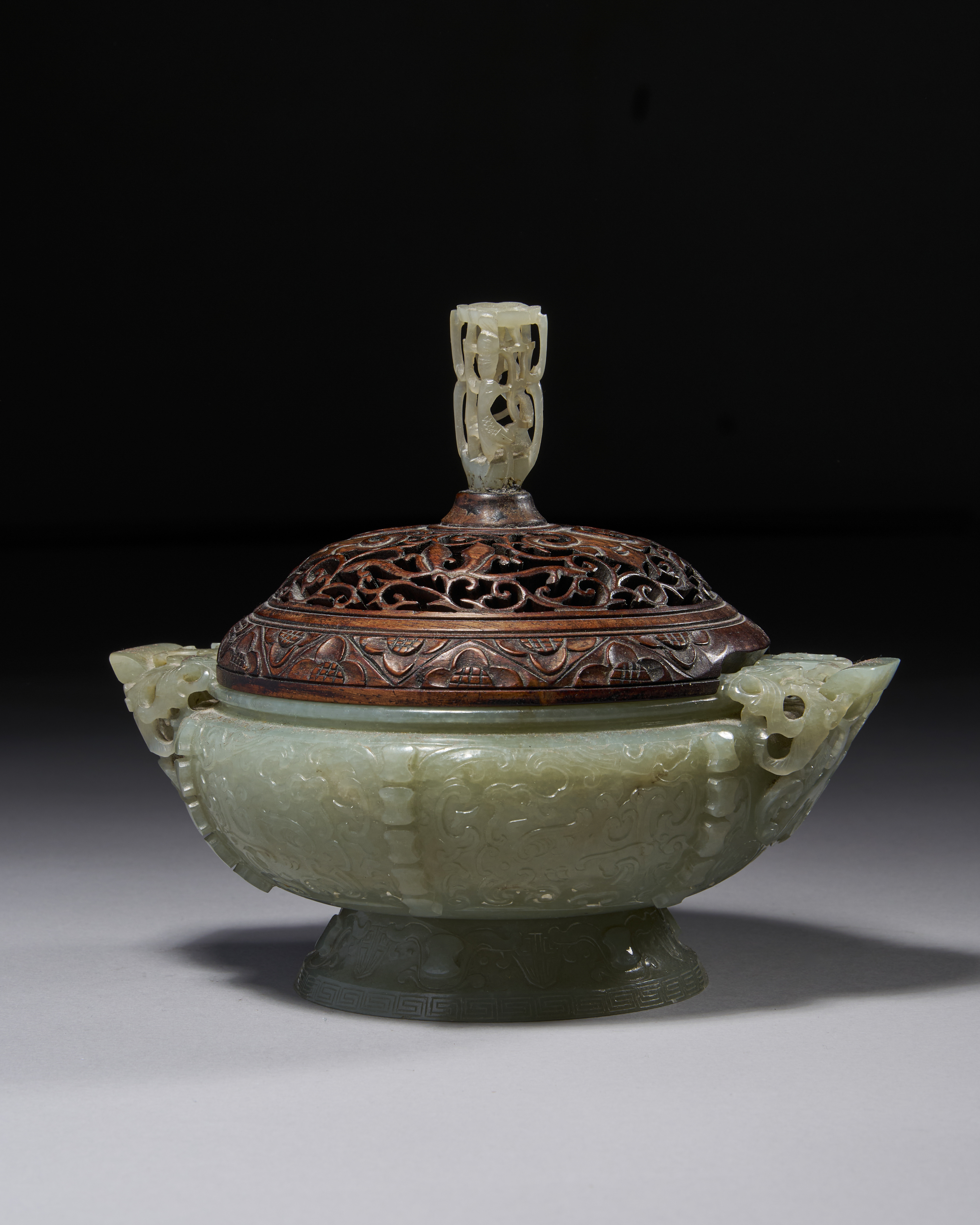 A CHINESE CARVED PALE GREENISH-WHITE JADE ARCHAISTIC CENSER AND COVER, QIANLONG PERIOD (1736-1795)