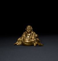 A CHINESE GILT BRONZE FIGURE OF A HOTEI & BOY, QING DYNASTY (1644-1911)