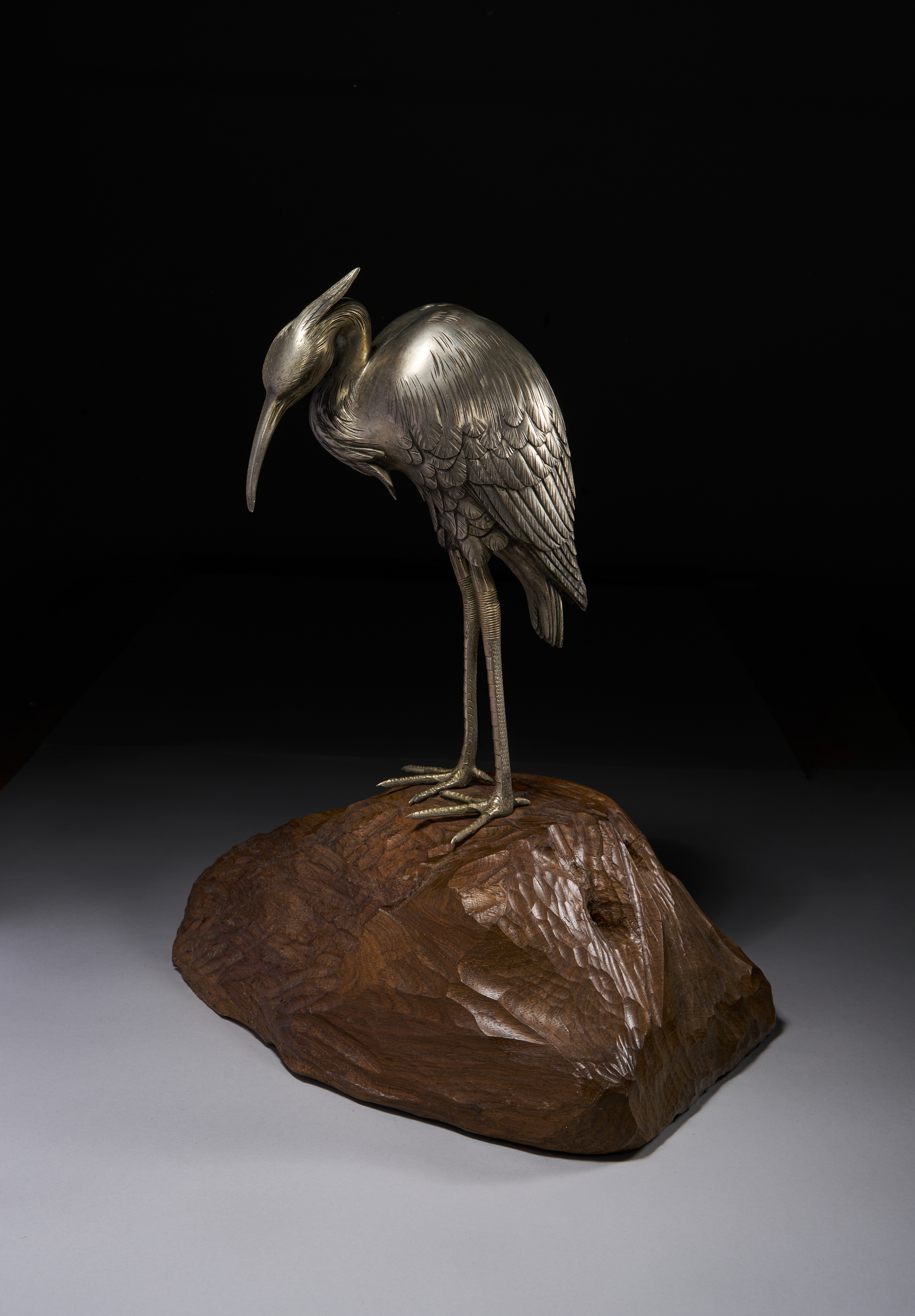 A SILVERED OKIMONO OF A CRANE, MEIJI PERIOD (1868-1912)