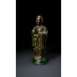 A LARGE BRONZE FIGURE OF ANANDA, MING DYNASTY (1368-1644)