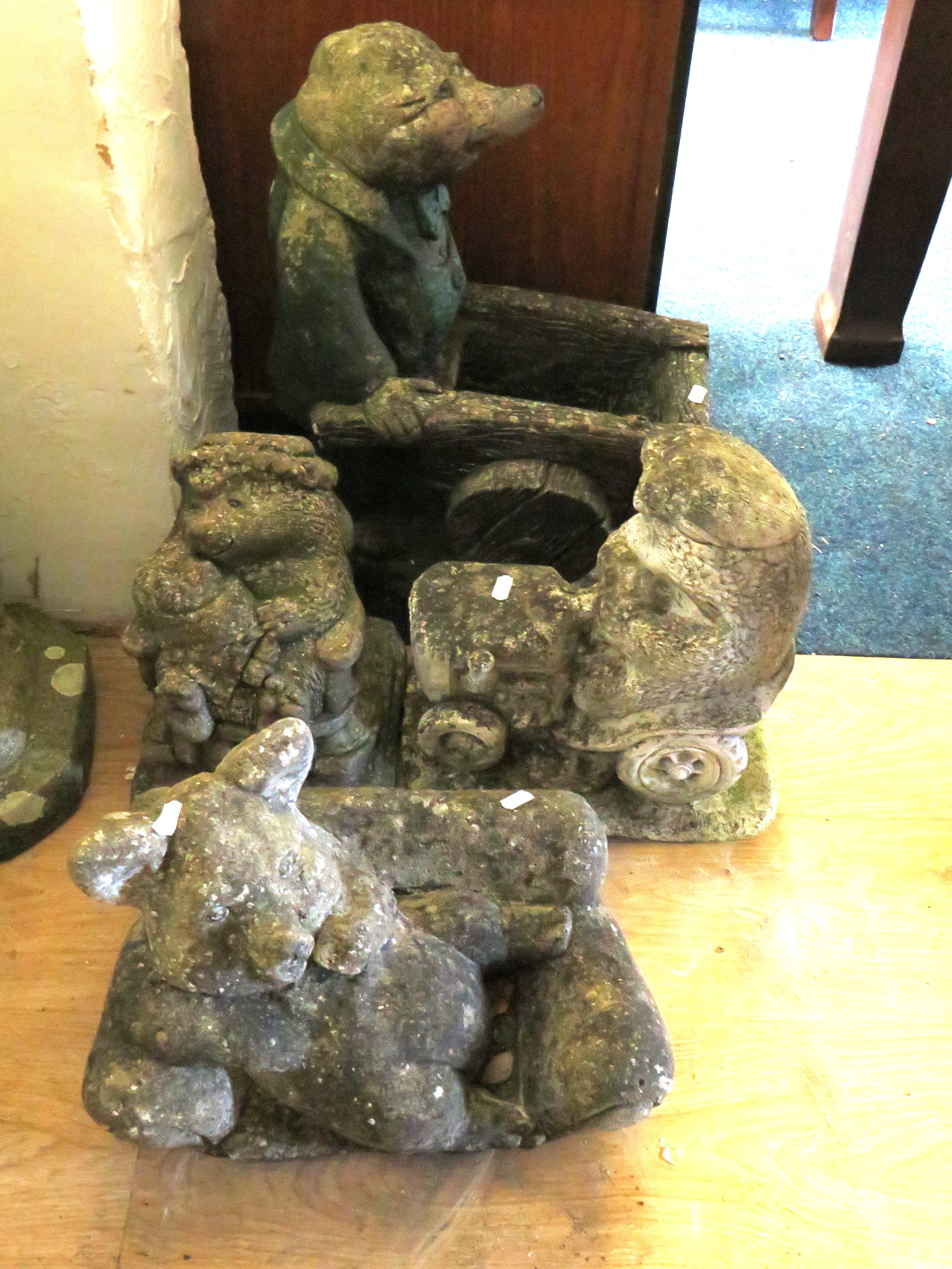 Four stone novelty Garden Stone Animal Ornaments. Largest measures approx  20 inches tall.   (These 