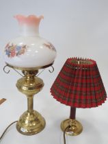 Two Electric table lamps. One in the style of an Oil lamp with decorative glass shade plus one other
