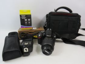 Nikon D3200 DSLR camera with lens and a addition flash, bag and accessories.