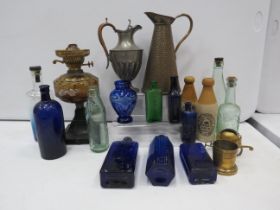 Mixed lot to include glass and stoneware bottles some with local interest, plus a hammered brass