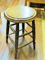 Handsome stool with turned legs and barrel turned stretchers. Studded circular top. Measures 22 inc
