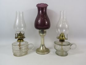 2 Vintage glass chamber oil lamps plus a candlestick lamp.