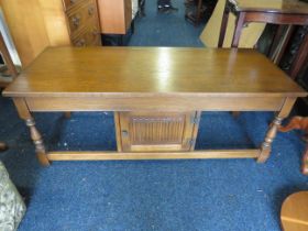 Old Charm low table with handy central cupboard with linen press decoration to cupboard door. In Ex