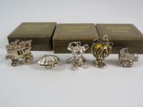 5 Ratners London large sterling silver charms.