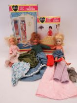 Three Vintage Sindy Dolls with assorted clothes along with a Boxed Sindy Wardrobe and a boxed Sindy