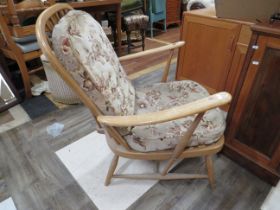 Ercol Chair with upholsered pads, some wear to webbing straps under. Some fading to arms etc. see ph