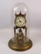 Brass Based Anniversary clock under a Glass Dome which measures approx 11 inches tall. Running order