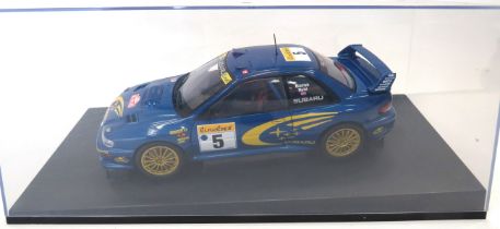 Auto Art 1:18 Scale Die Cast Model of a Subaru Impreza 2001 WRC World Champion Winner. Housed under