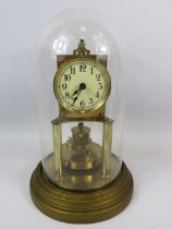 Gustav Becker Brass based Anniversary Clock under a Glass dome. Running order but no key present. Me