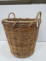 Large twin handle wicker log basket, approx 60cm tall and diameter 52cm.