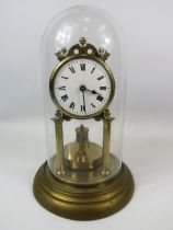 German Made Brass based Anniversary clock with enamel Dial. Sits under a Glass dome which measures a