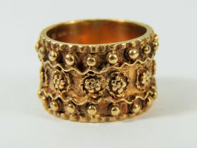 9ct Yellow Gold Ring set with decorative work surround in eternity pattern. Deep ring at 14mm, F