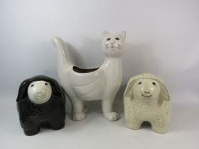 3 Ceramic planters in the forms of sheep and a cat, The cat measures 40cm tall and 33cm wide.