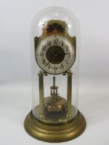 Large German Made Brass Based Anniversary clock under Glass dome which measures approx 14 inches tal