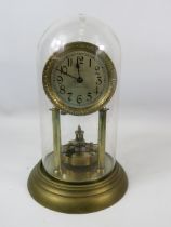 Brass Based Anniversary clock under a Glass Dome which measures approx 11 inches tall. Running order