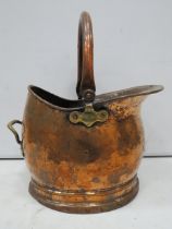 Vintage hammered copper helmet shape coal bucket.