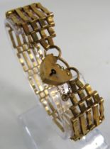 9ct gold 5 bar gate bracelet with padlock and saftey chain. 10.4 grams.