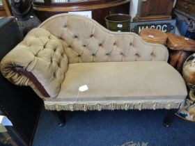 Small upholstered Chaise which measures 36 inches tall by approx 40 inches long. Seat height approx
