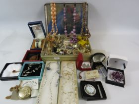 Tin of various costume jewellery including some which are boxed, Watches, necklaces, etc.