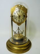 Brass based Anniversary clock under perspex Dome. Appears to be in running order but no key present