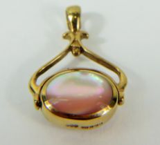 9ct Yellow Gold spinning fob pendant set with an oval piece of Mother of Pearl in a pink shade 28 x