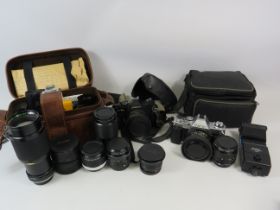 2 Vintage cameras Cannon & Cosina plus various lenses by Vivtar etc.