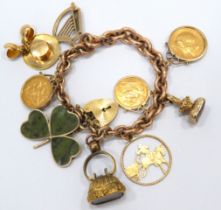 Heavy Solid Link 9ct Gold Bracelet festooned with 9ct Charms, Two Half Sovereigns and one Full Sover