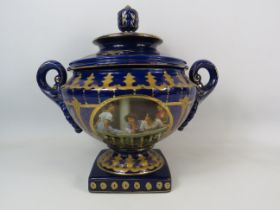 Large Royal Limoge blue and gold twin handle lidded urn vase with panels dipicting girls on a