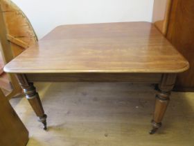 Early 20th Century Dark Oak Dining table raised on tapered castored legs which measures approx H:29