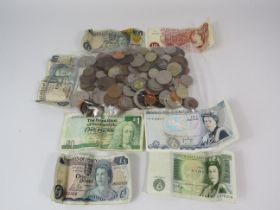 Selection of various coins and various vintage banknotes.
