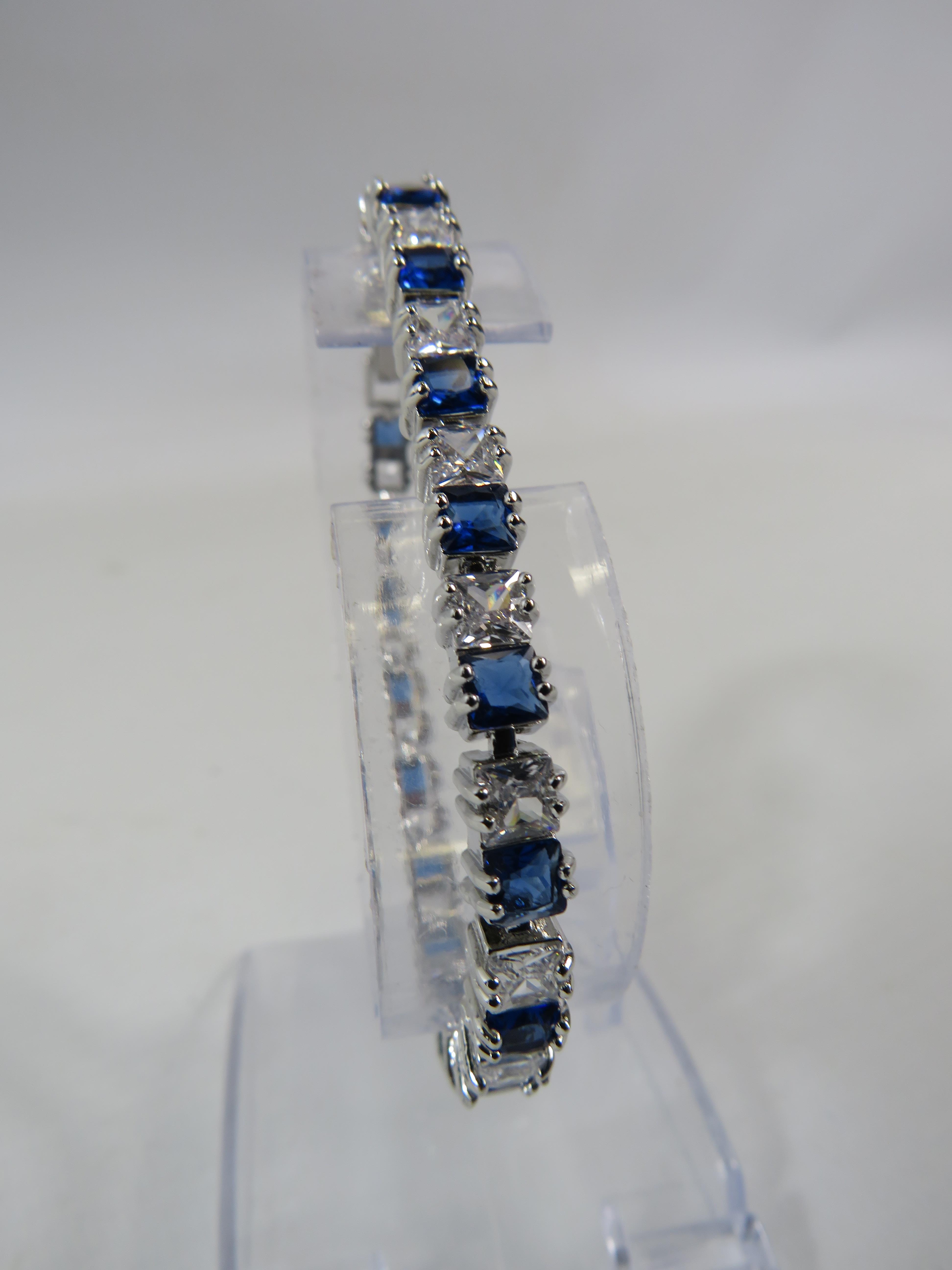 925 silver blue and clear gemstone tennis bracelet with extension link.