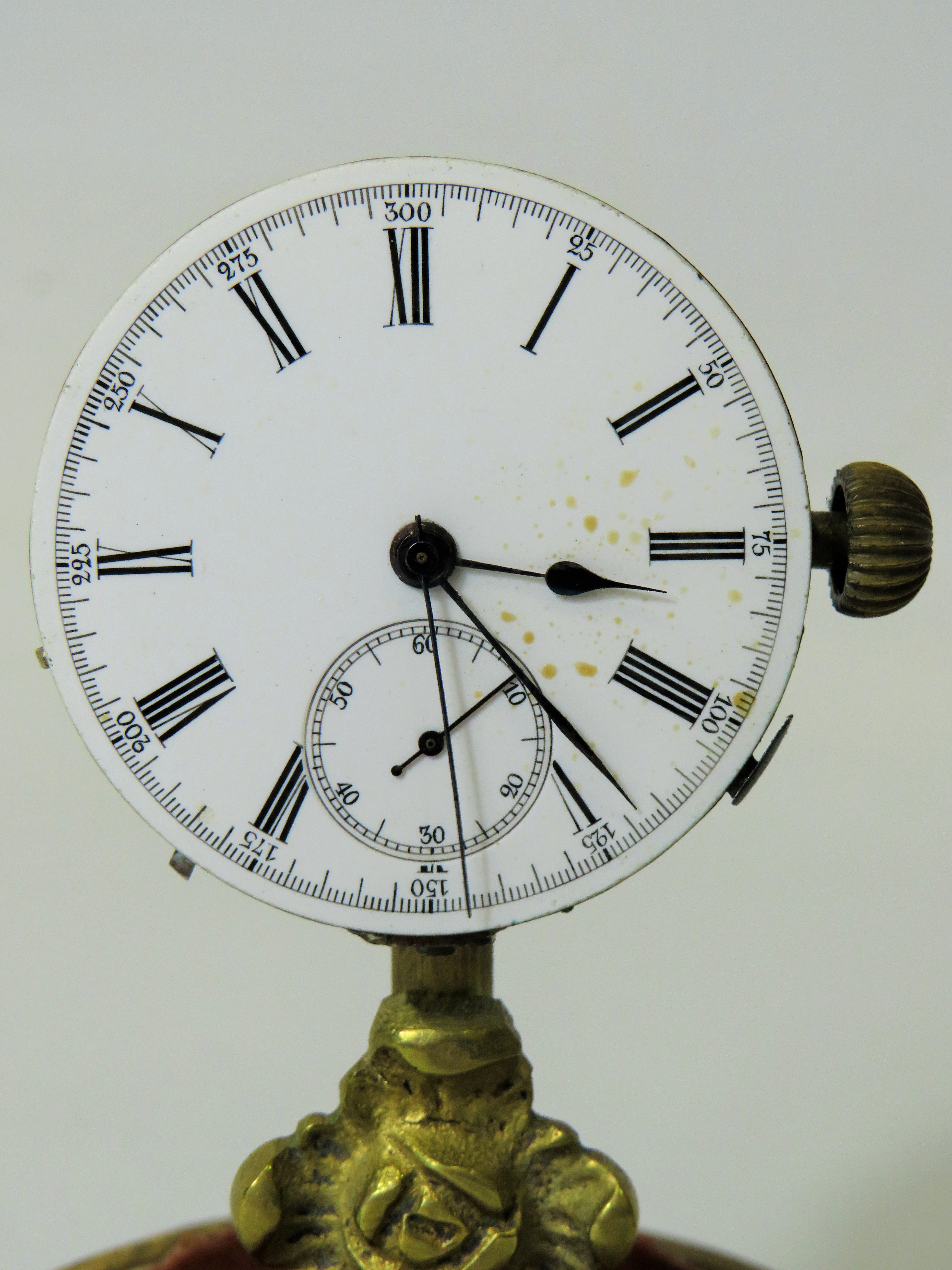 Unusual enamel faced Pocket watch which has been mounted on a brass and wooden stand and under a gla - Image 3 of 4