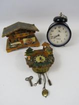 Vintage wooden house music box, mini german clock and a alarm clock.