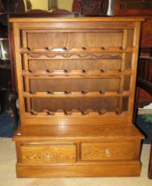 Oak Wine rack with two handy drawers below. Raised on a plinth base it measures approx H:37 x W:30 x