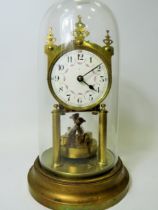 Brass based Anniversary clock under Glass Dome.  Appears to be in running order but no key present. 