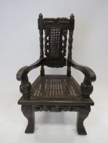 Large darkwood Dolls chair in the Victorian Gothic style. Measures 20 inches tall. One small Dolls t