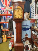 Stained pine reproduction long cased clock with quartz movement and shelves revealed behind door. M