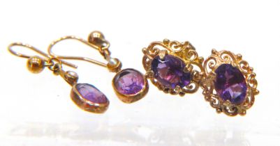 Two Pairs of 9ct Gold Amethyst set ear studs. 1.6g in total . See photos.