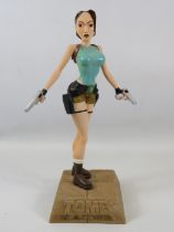 Hard Resin Model of Tomb Raider Laura Croft standing on Stone effect plinth. Excellent condition , n