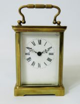 Brass Carriage Clock with enamel face. Glass panels and door. Makers or Retailers mark of ACC Runni