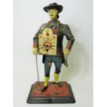 Early 20th Century Cast Iron figural novelty Clock as a Clock Peddler. Painted cast Iron body in goo