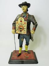 Early 20th Century Cast Iron figural novelty Clock as a Clock Peddler. Painted cast Iron body in goo