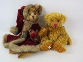 Hermann original mohair teddy bear sucking his thumb plus a Bearington bear in christmas outfit.