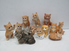 Selection of various large resin cat figurines.