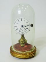 Unusual enamel faced Pocket watch which has been mounted on a brass and wooden stand and under a gla