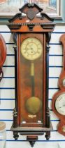 Large Mahogany Cased wall clock with enamel face, single weight driven with pendulum. Approx 48 inc